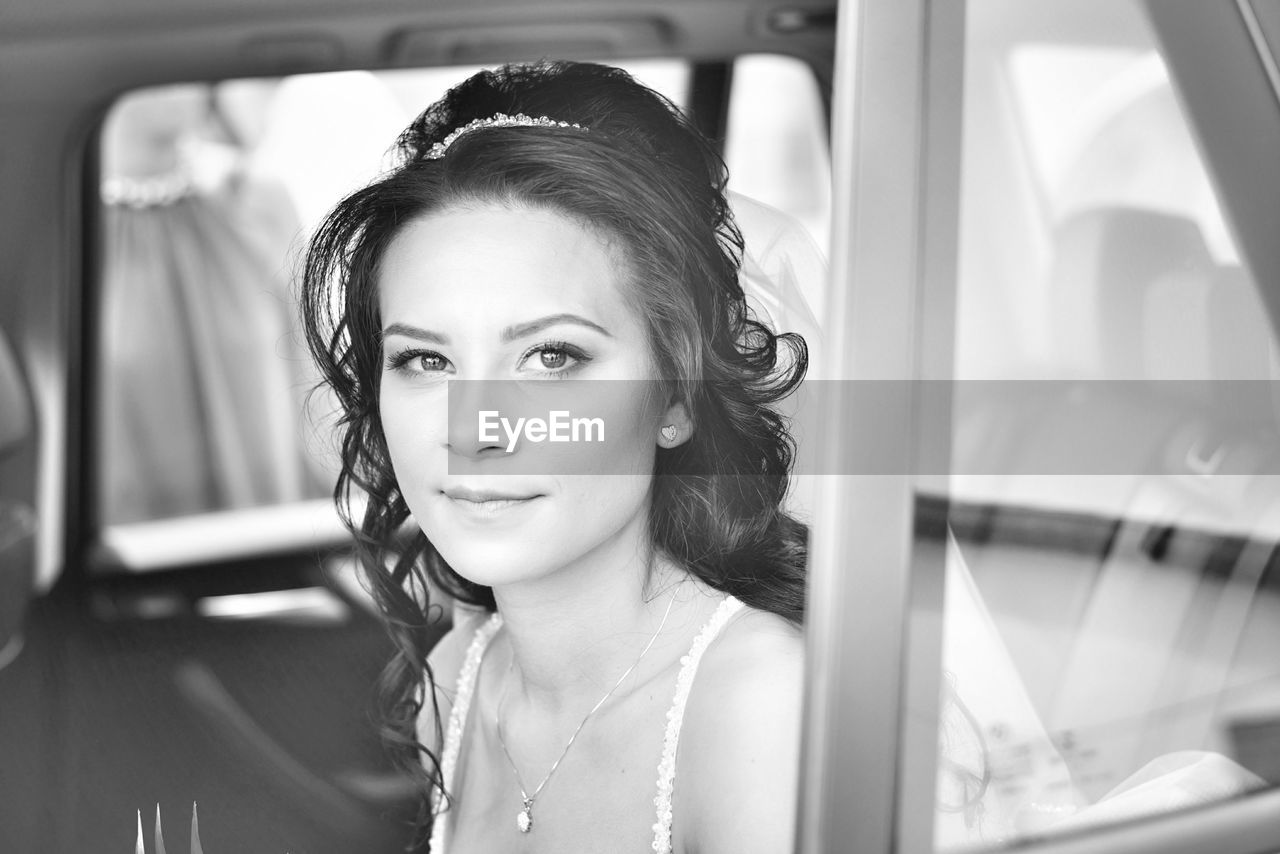 Portrait of woman sitting in car