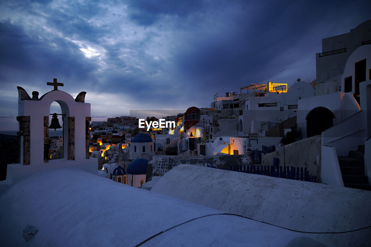 Houses in city at night