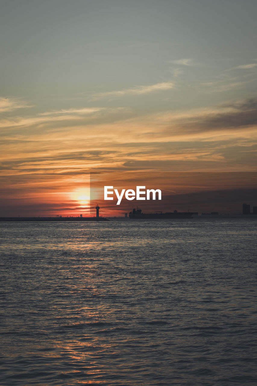 Scenic view of sea against sky during sunset