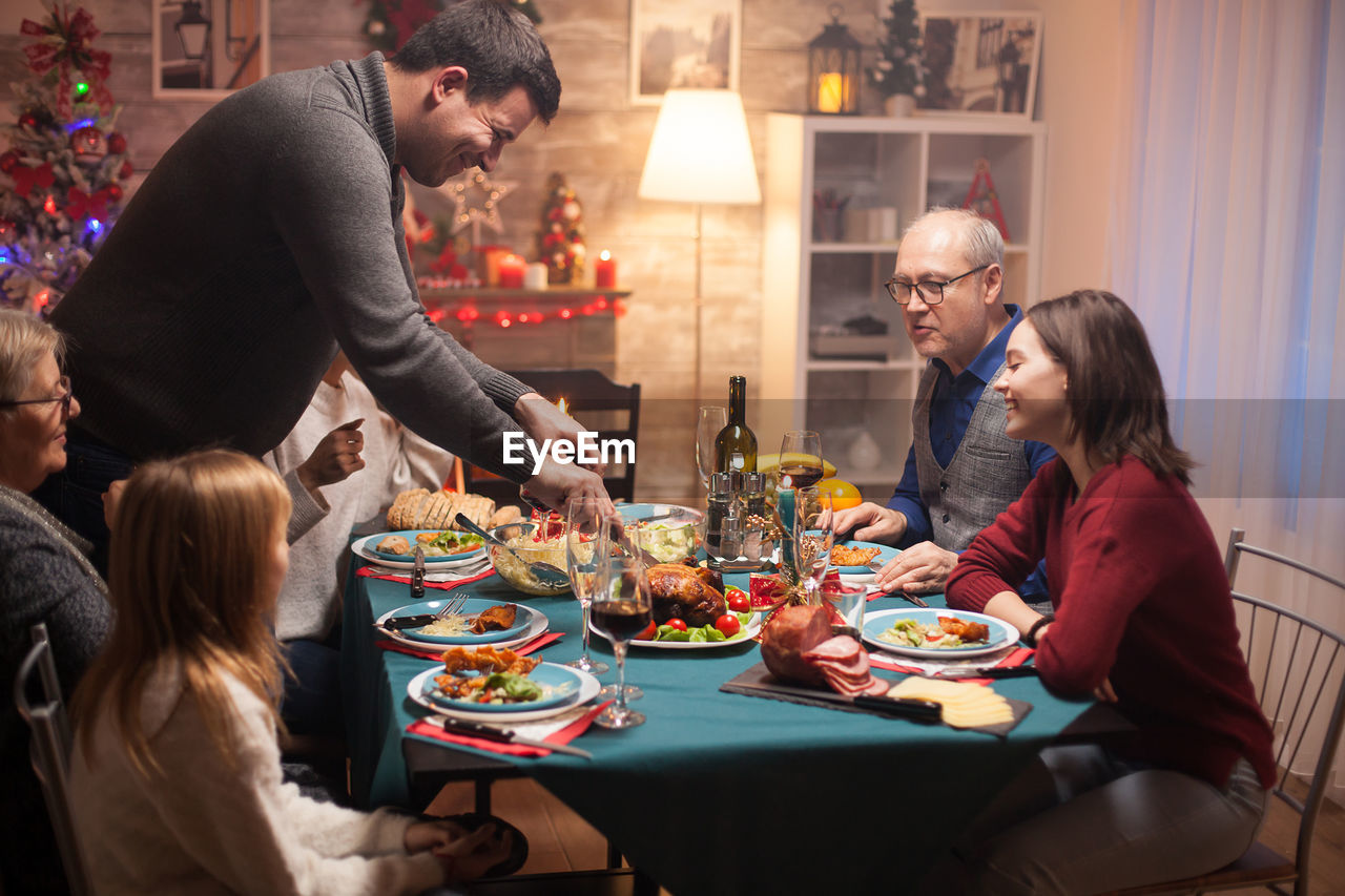 People sitting on table at home