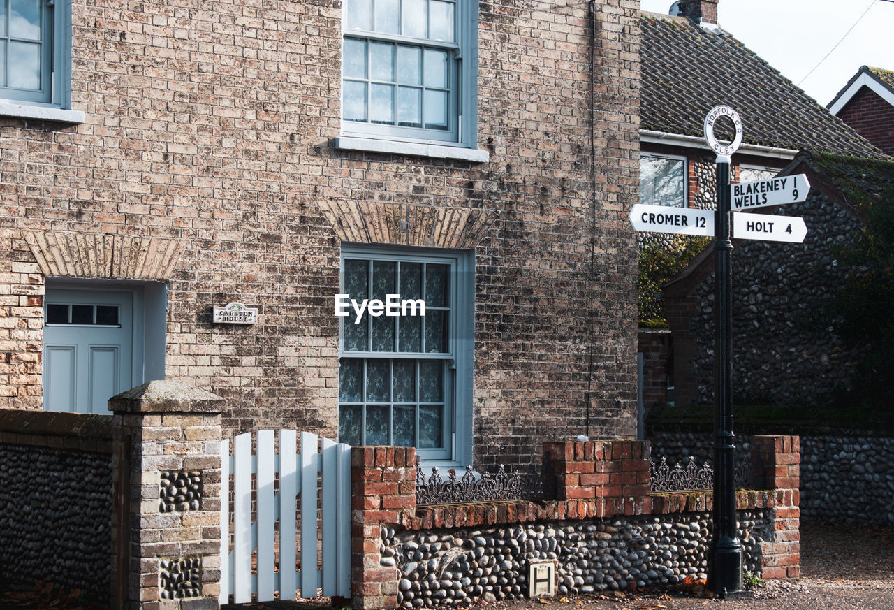 TEXT ON WALL OF BUILDING WITH CITY