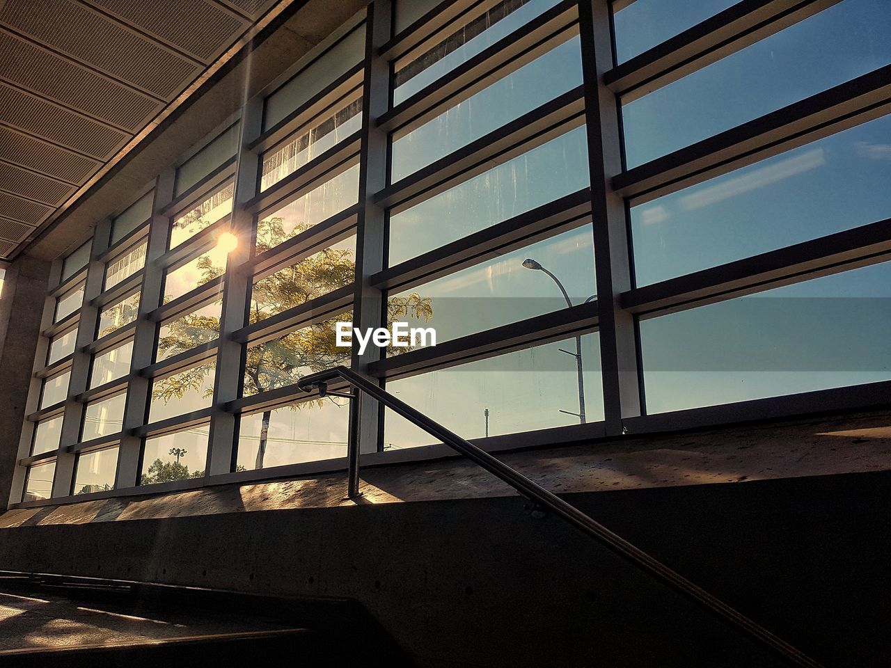 LOW ANGLE VIEW OF MODERN GLASS WINDOW