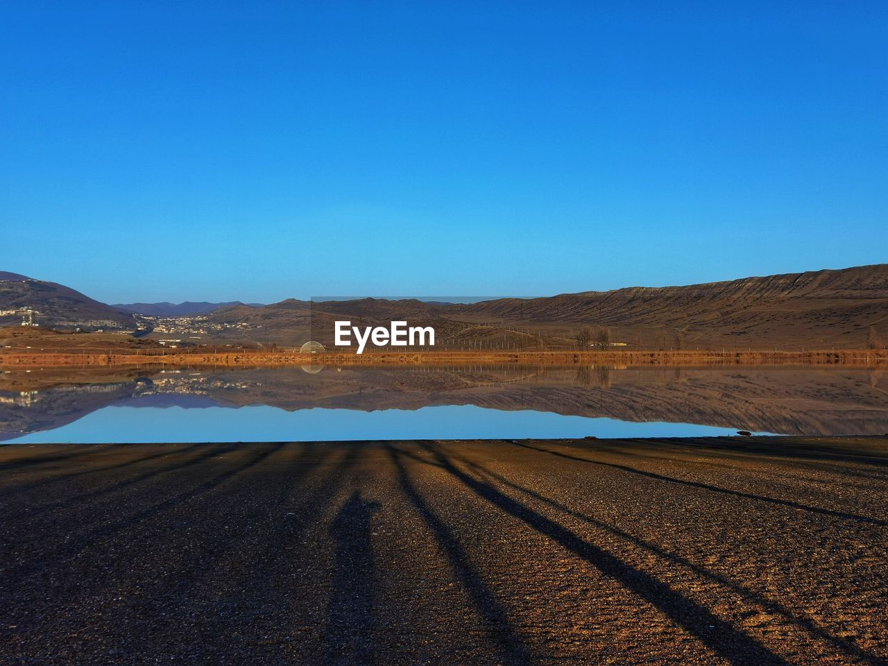 SCENIC VIEW OF LAND AGAINST BLUE SKY