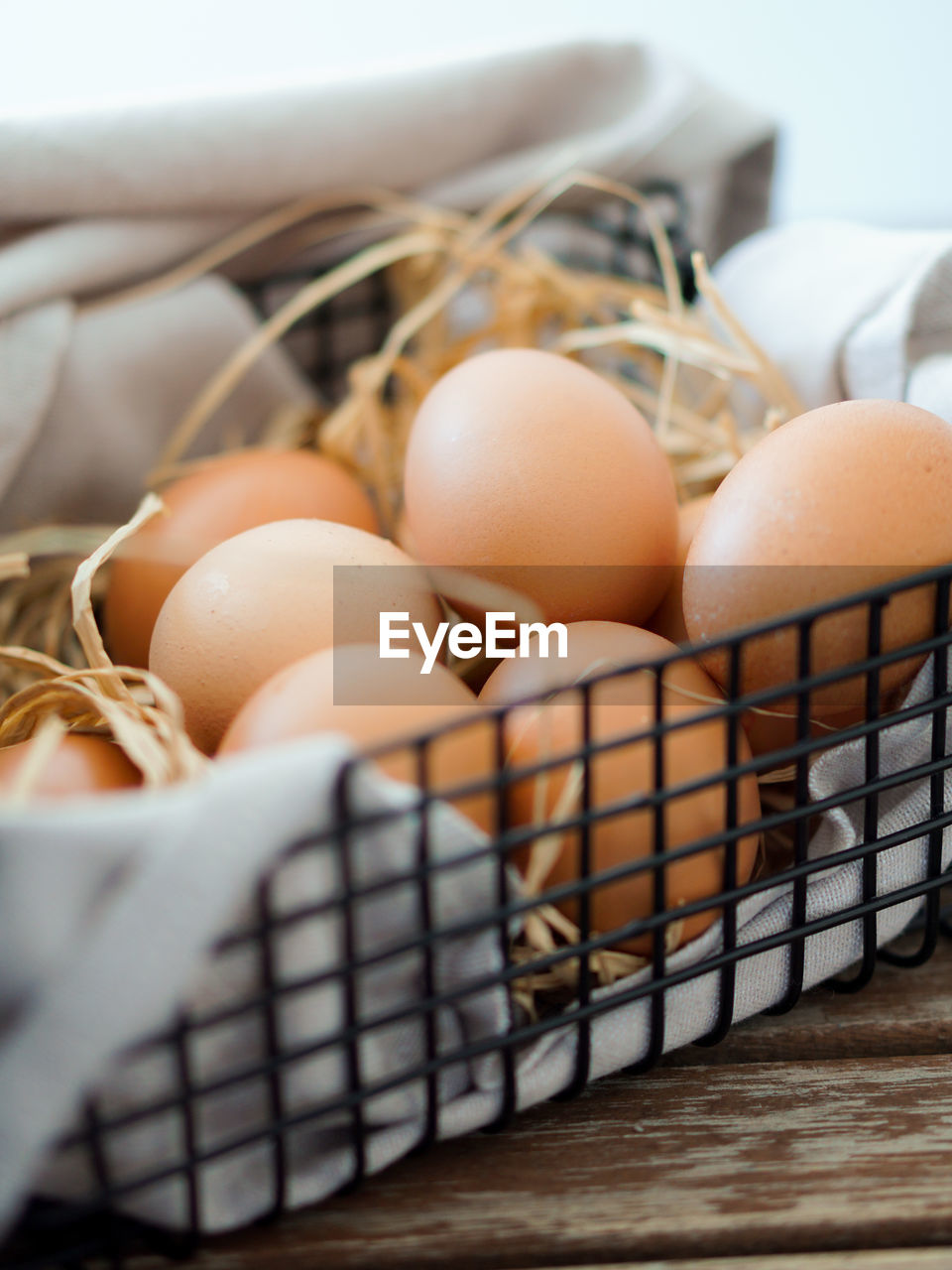 Close-up of eggs in basket on table