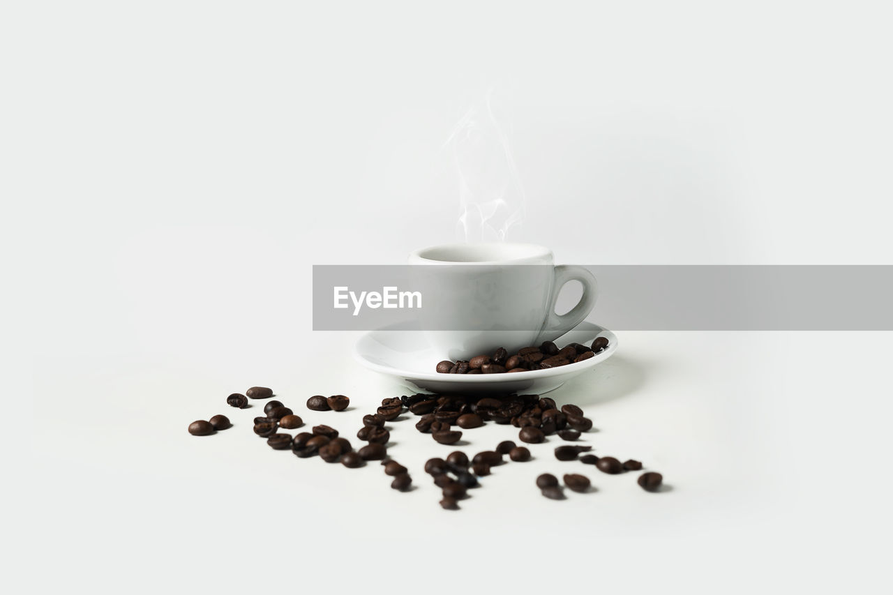 Close-up of coffee cup against white background