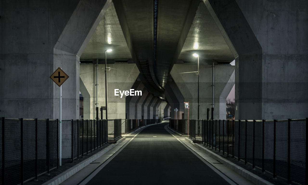 View of empty road under bridge