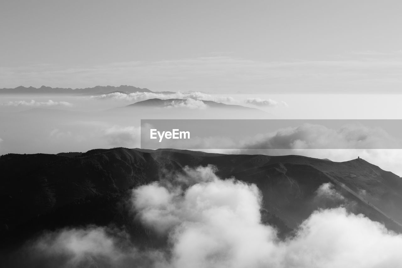 SCENIC VIEW OF CLOUDSCAPE OVER MOUNTAINS