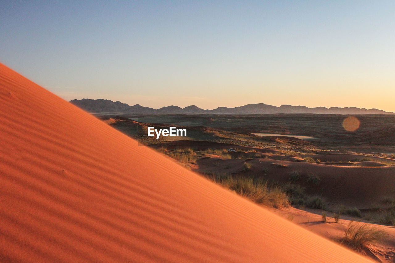 SCENIC VIEW OF LANDSCAPE AT SUNSET