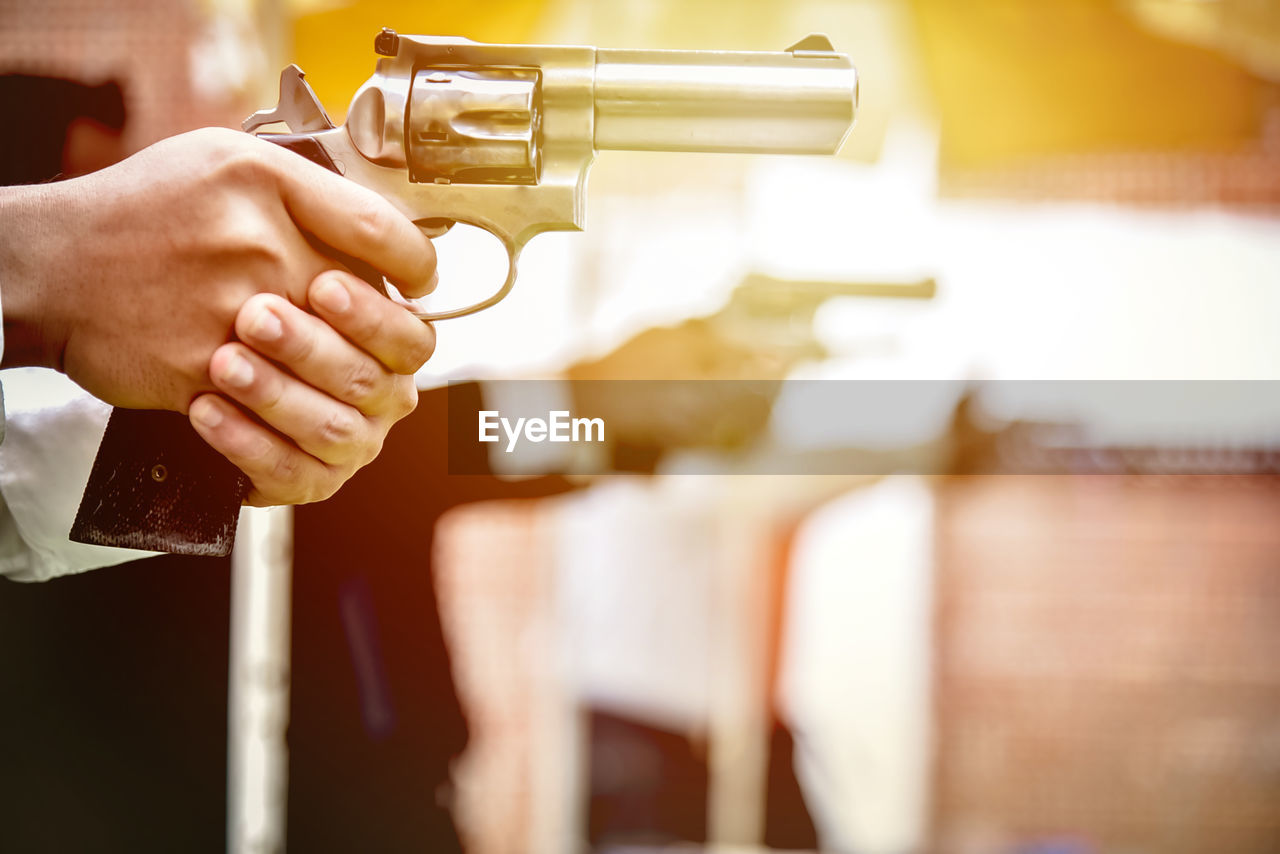 Close-up of person holding gun