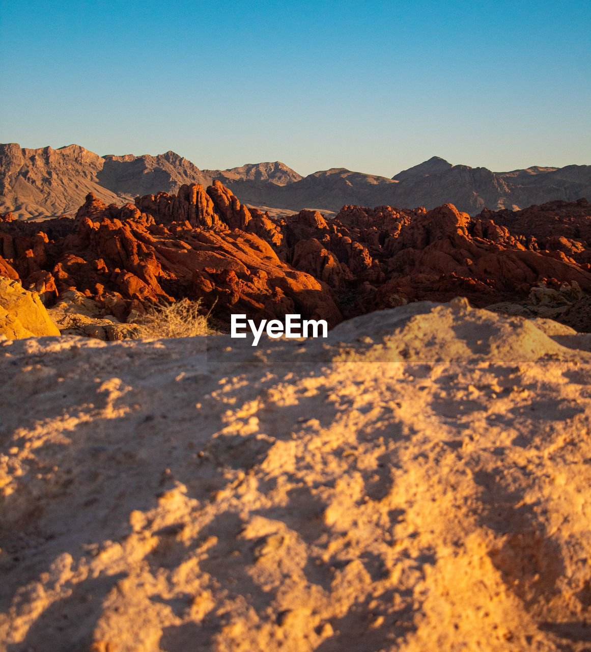 Scenic view of different colored mountains against clear sky