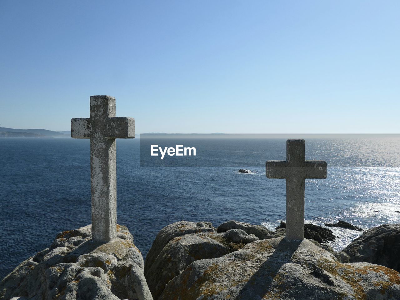 Scenic view of sea against clear blue sky