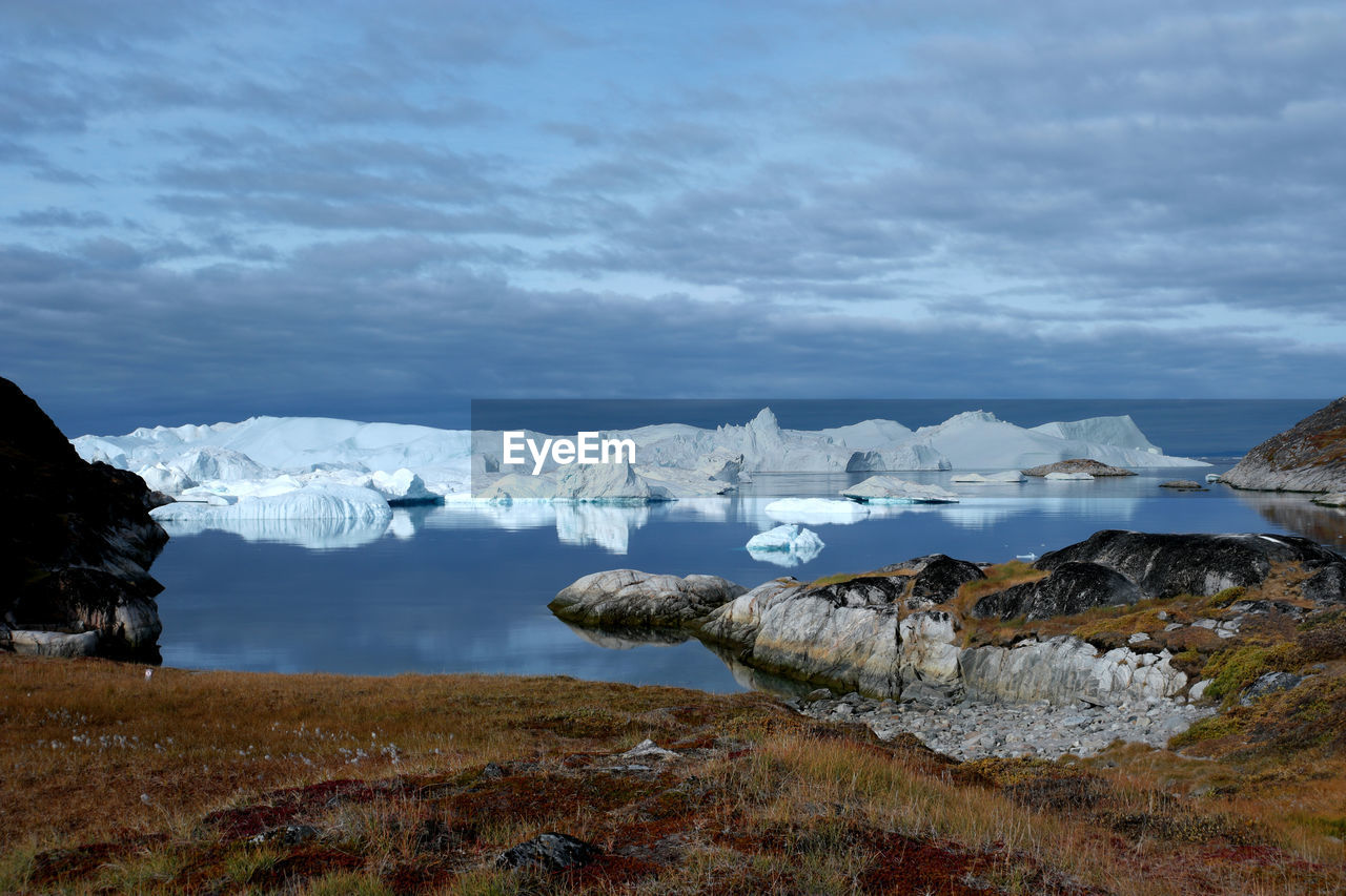 Scenic view of frozen lake against sky