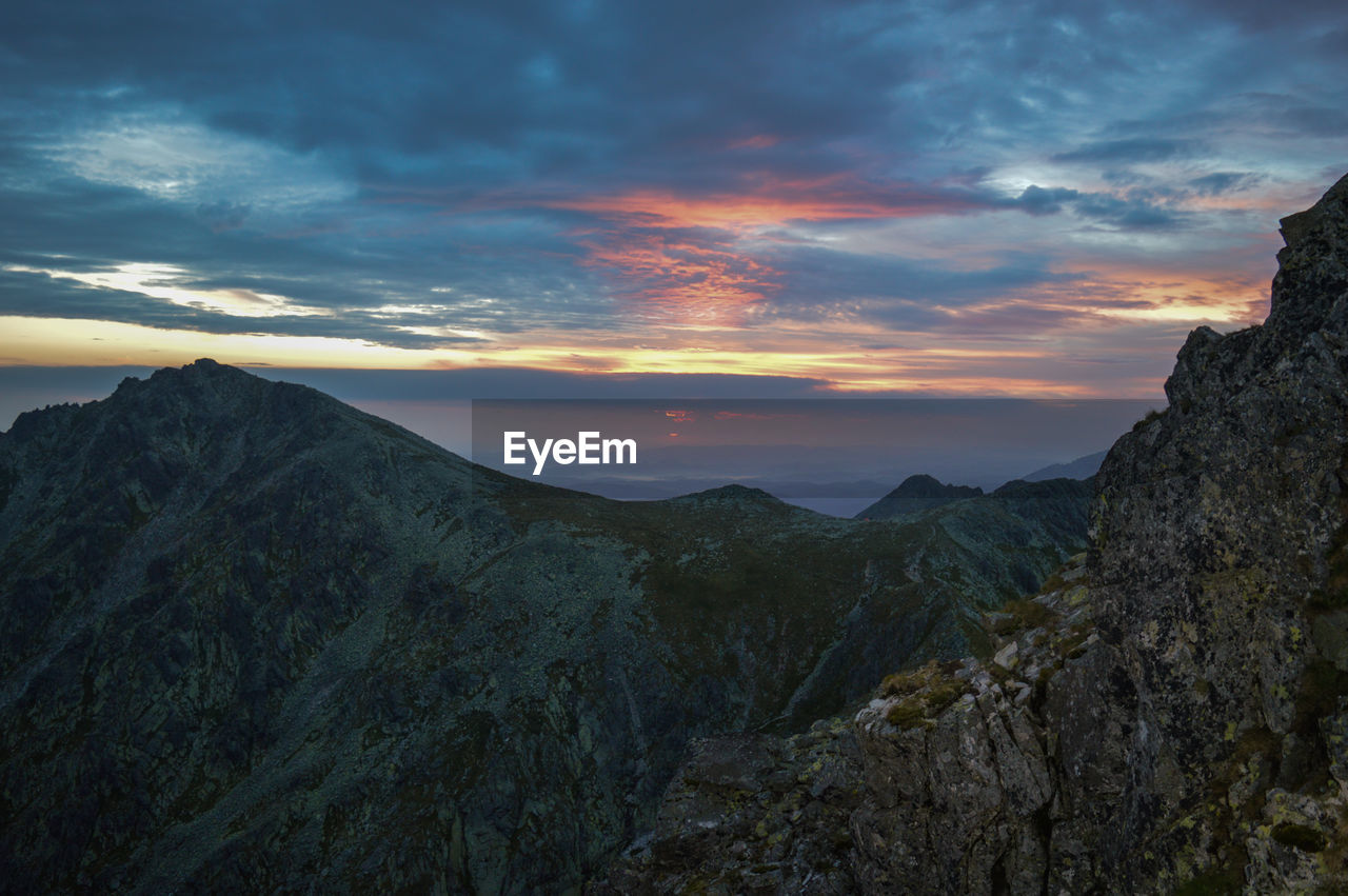 Scenic view of mountains against sky during sunset