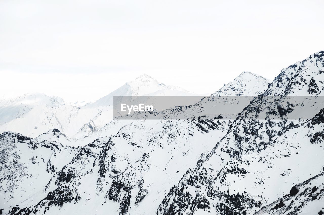 SCENIC VIEW OF SNOWCAPPED MOUNTAIN AGAINST SKY