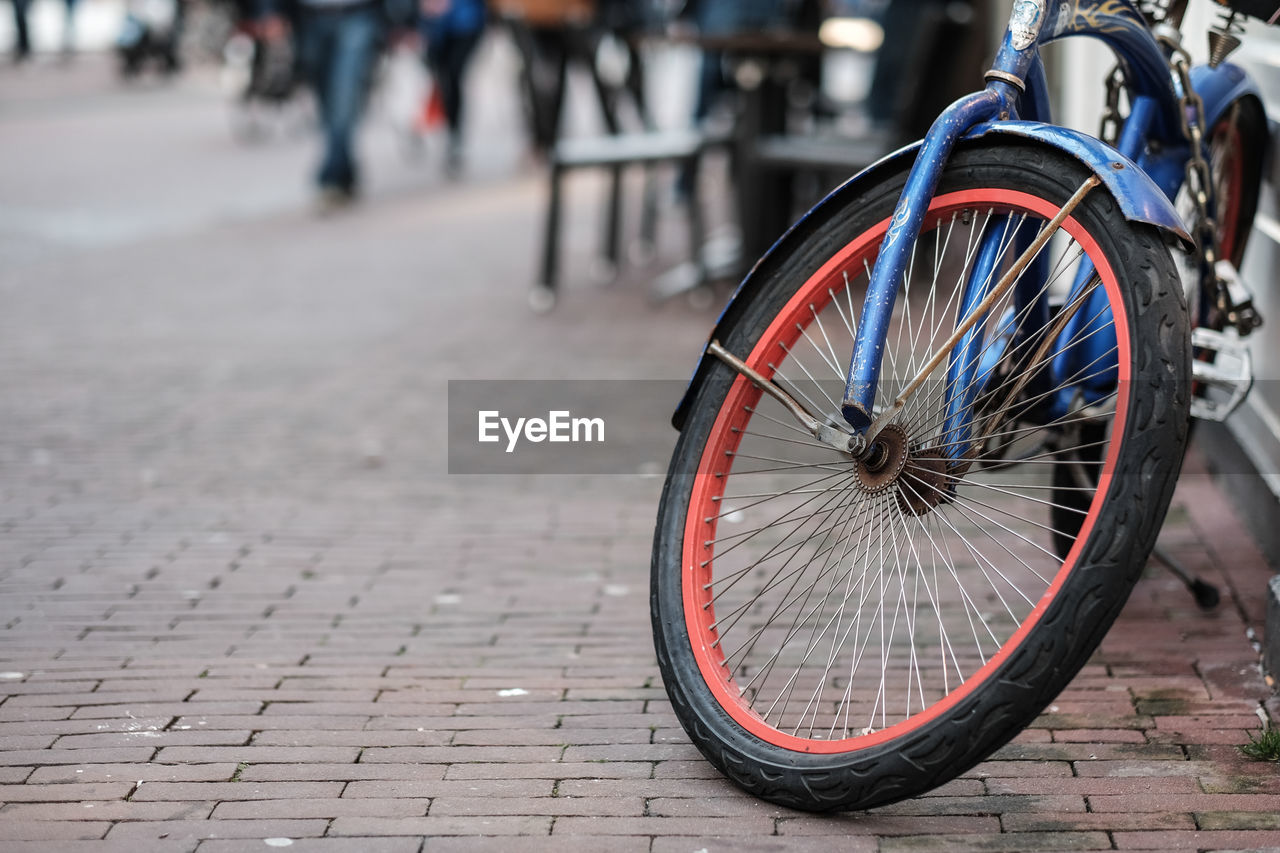 Close-up of bicycle on street