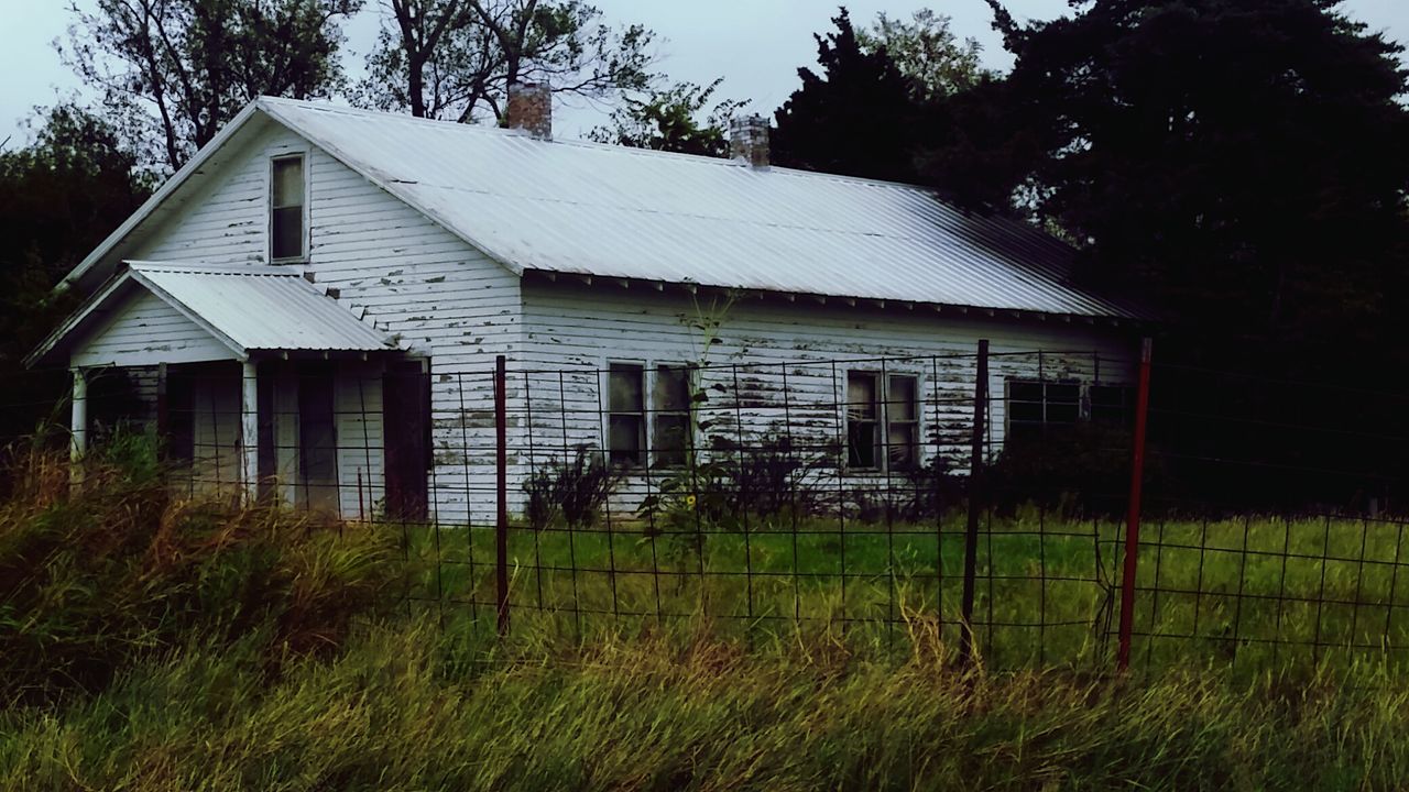 VIEW OF HOUSES IN FIELD