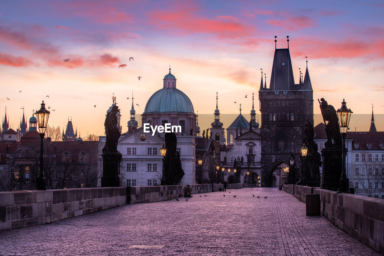 View of charles bridge in prague during sunset, czech republic. the world famous prague landmark.