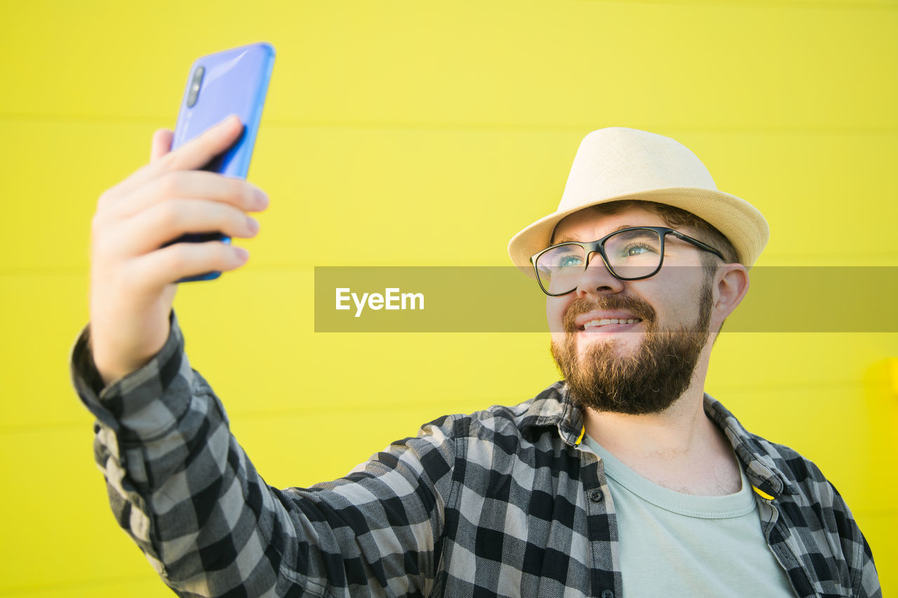 portrait of young man using phone