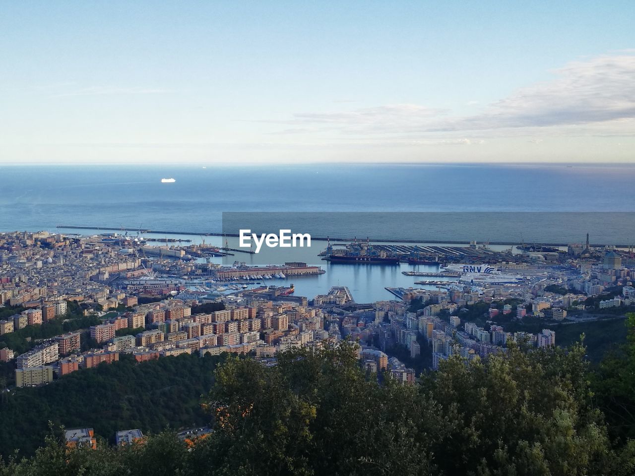 HIGH ANGLE VIEW OF CITY AT SEASIDE