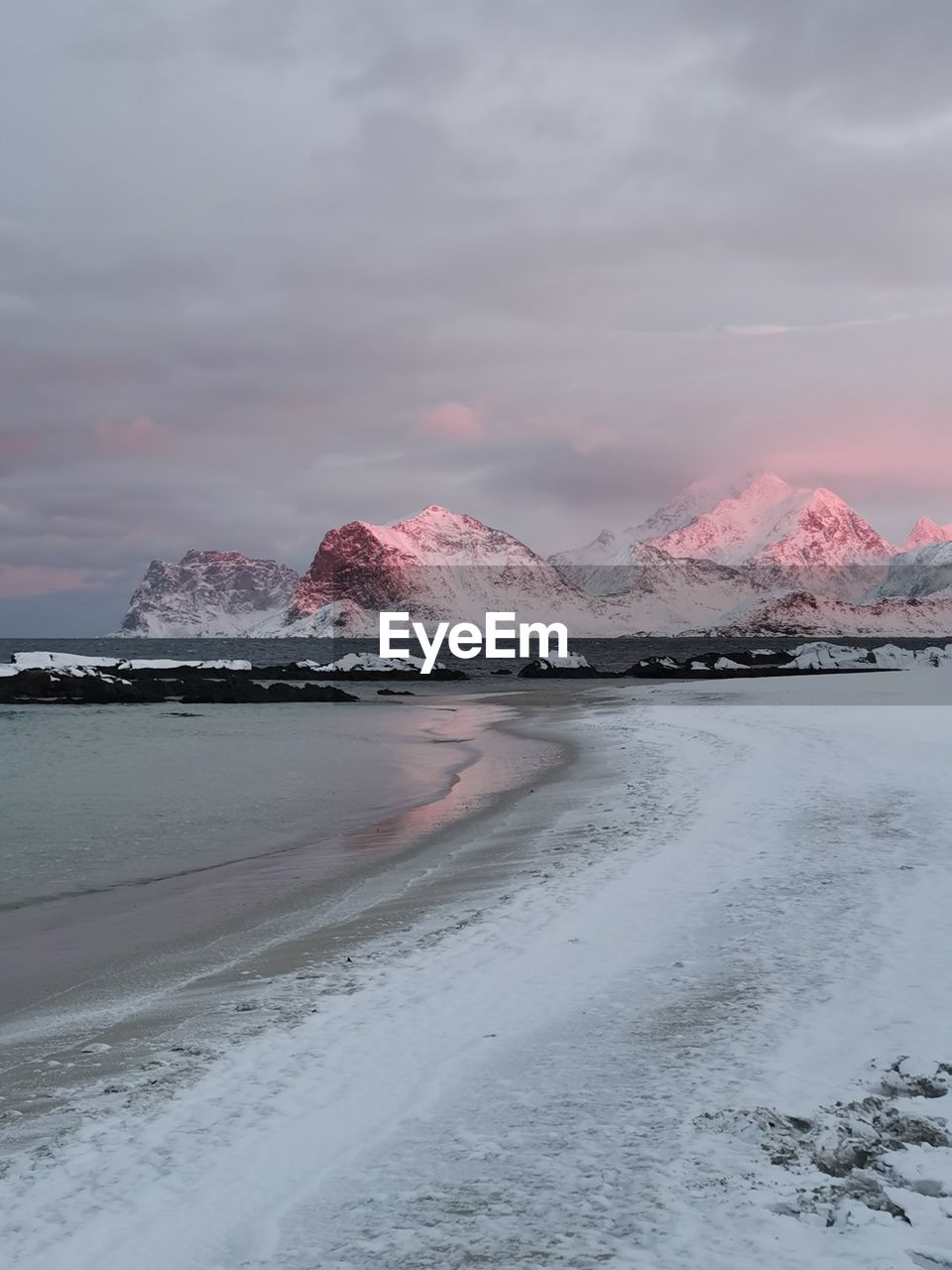 scenic view of beach against sky during sunset