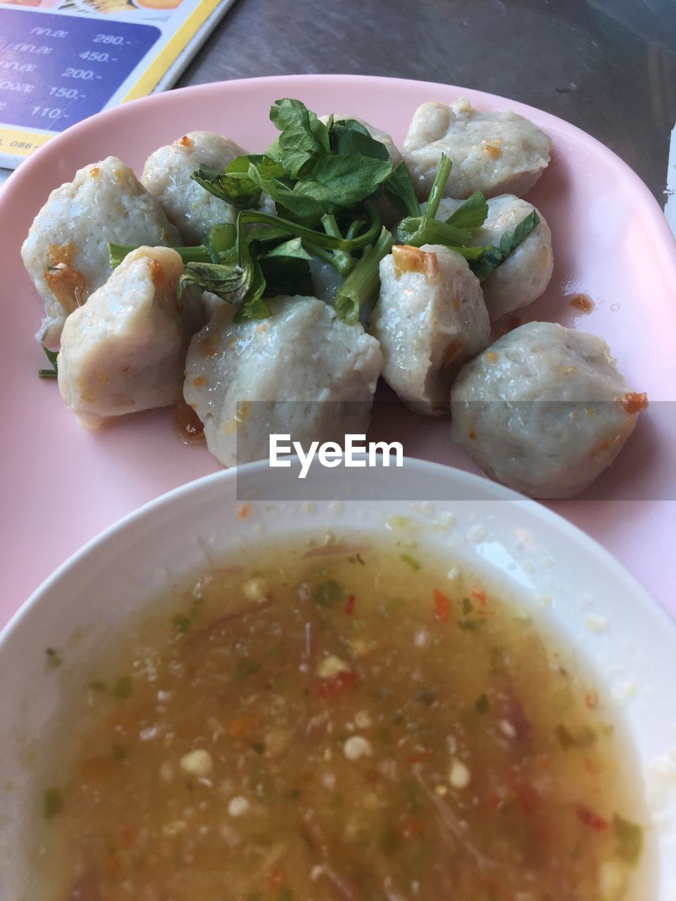 Close-up of food with soup on table