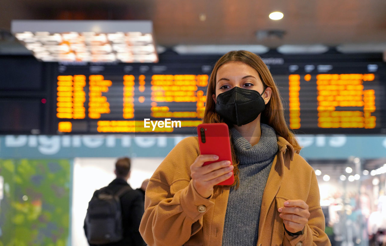 Traveler woman wearing kn95 ffp2 face mask at the subaway station
