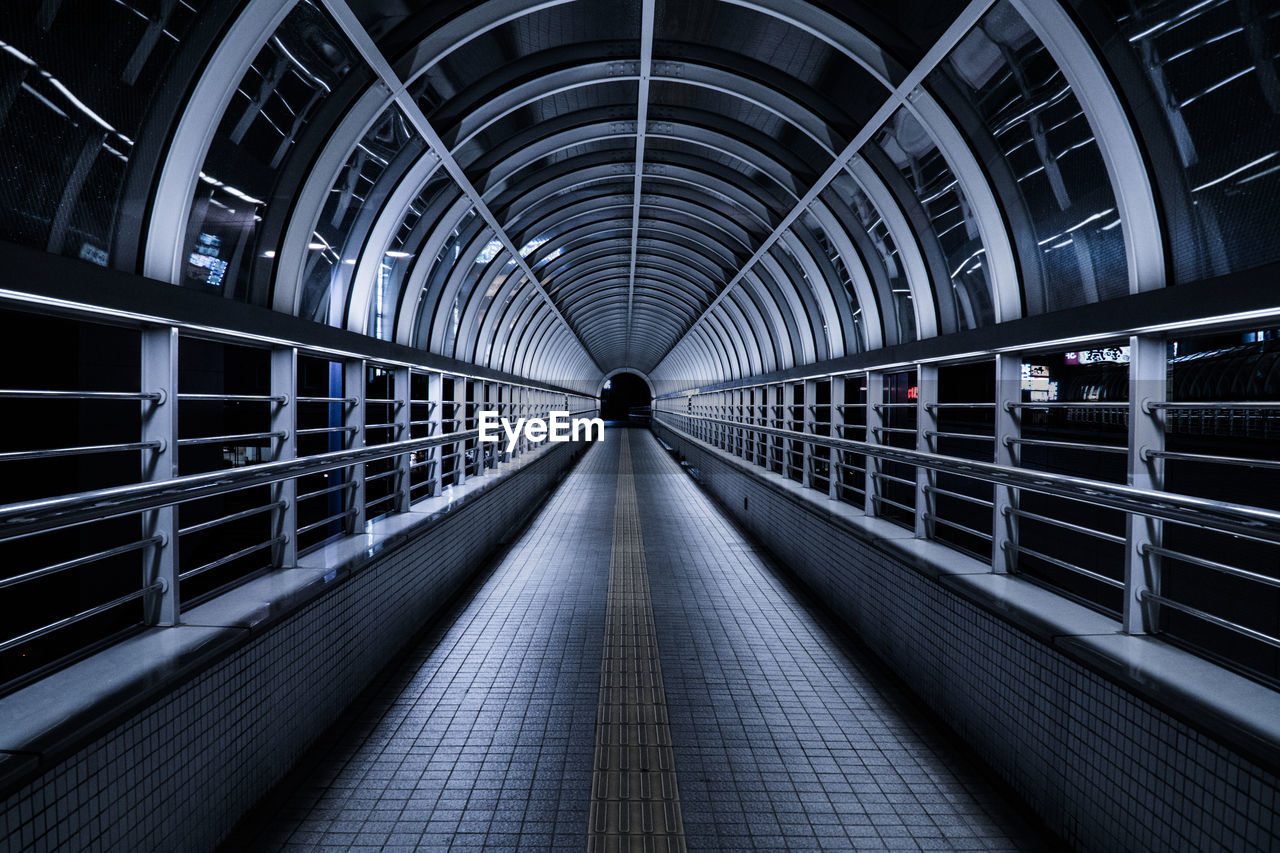 Empty illuminated footbridge