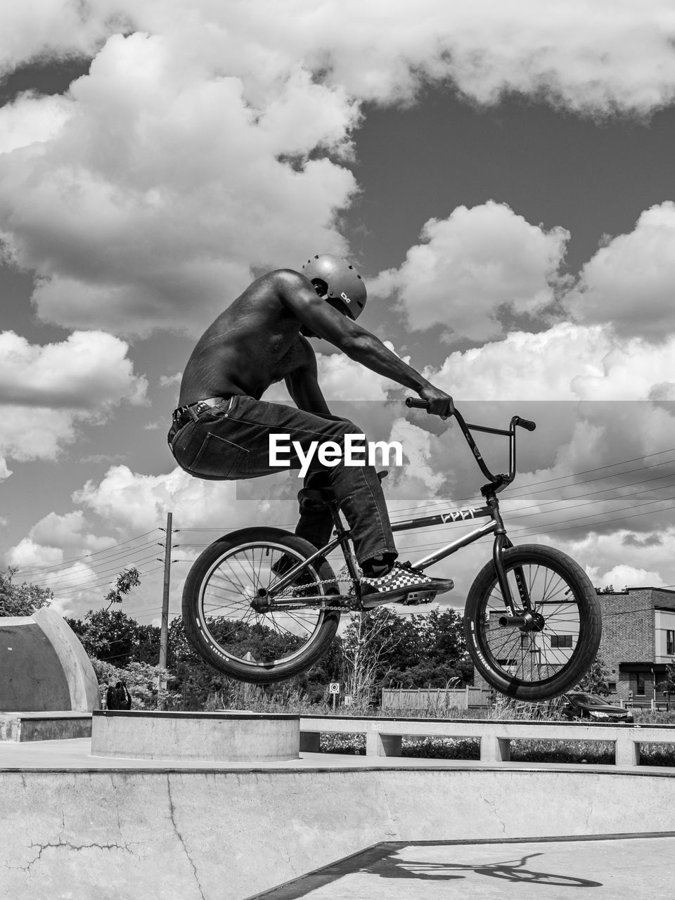 sports, bicycle, cycle sport, cloud, bicycle motocross, transportation, one person, bmx cycling, stunt, activity, sky, black and white, men, cycling, motion, bmx bike, full length, lifestyles, adult, extreme sports, monochrome, leisure activity, skill, vehicle, city, nature, architecture, monochrome photography, riding, day, mode of transportation, mid-air, recreation, outdoors, young adult, sports equipment, helmet, risk, vitality, low angle view, youth culture, headwear, exercising, city life, skateboard park, jumping, casual clothing