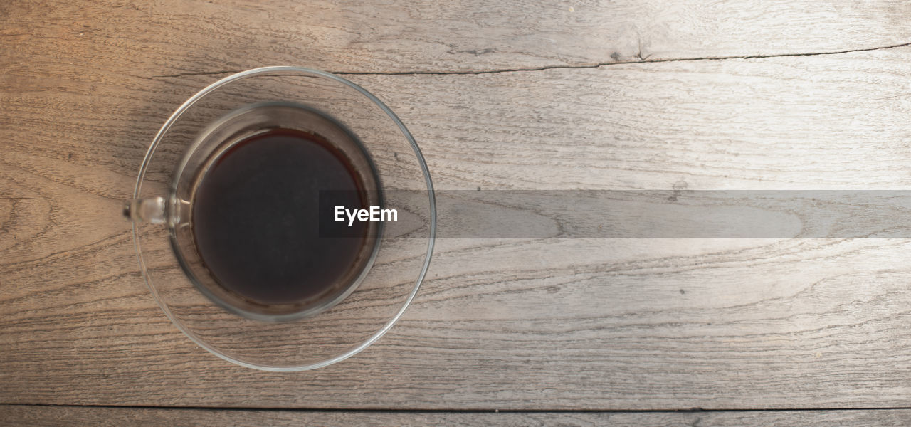 CLOSE-UP OF COFFEE CUP ON TABLE