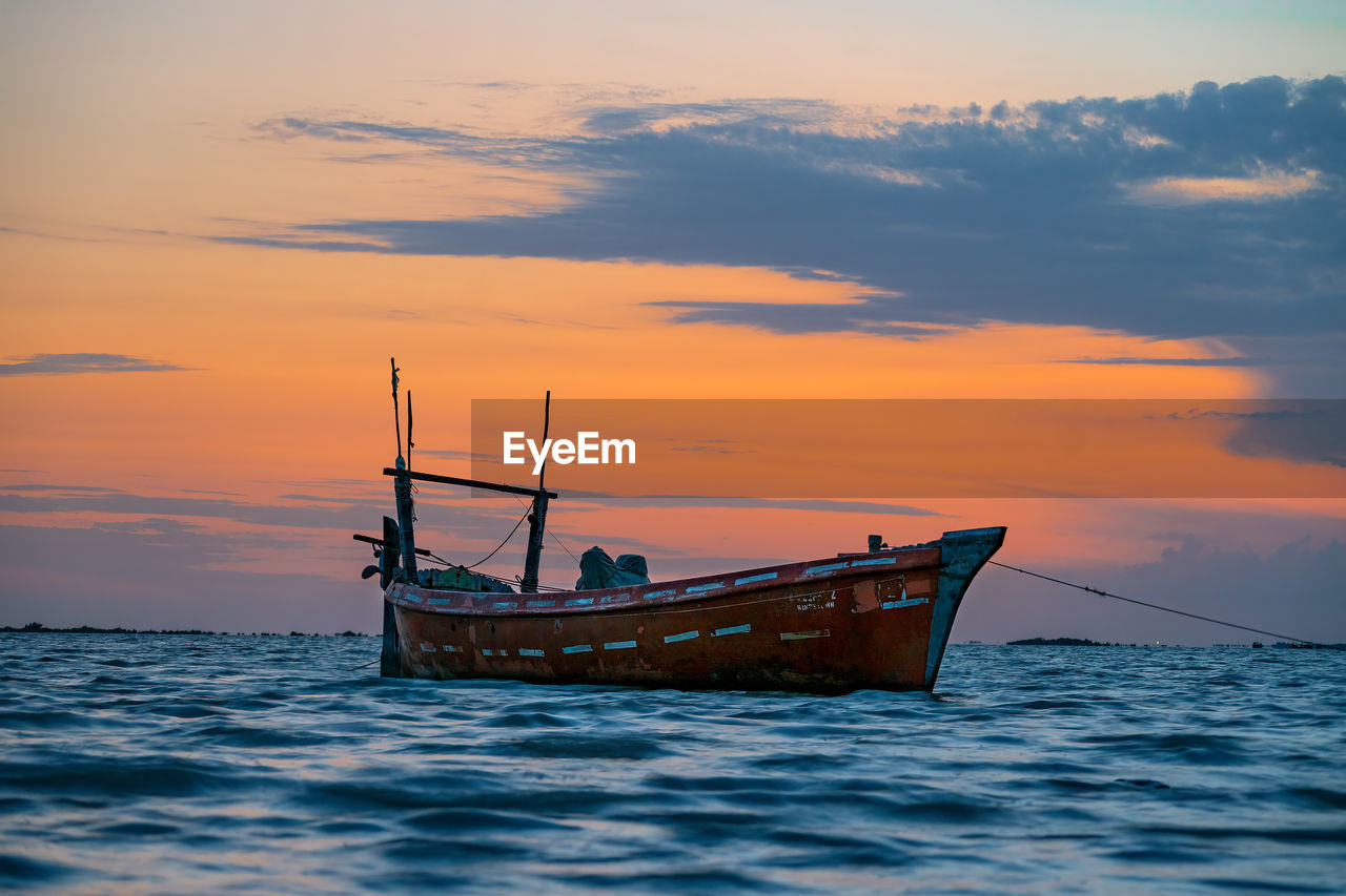 Sunset view with cloudy sky at gadani beach with dhow boat