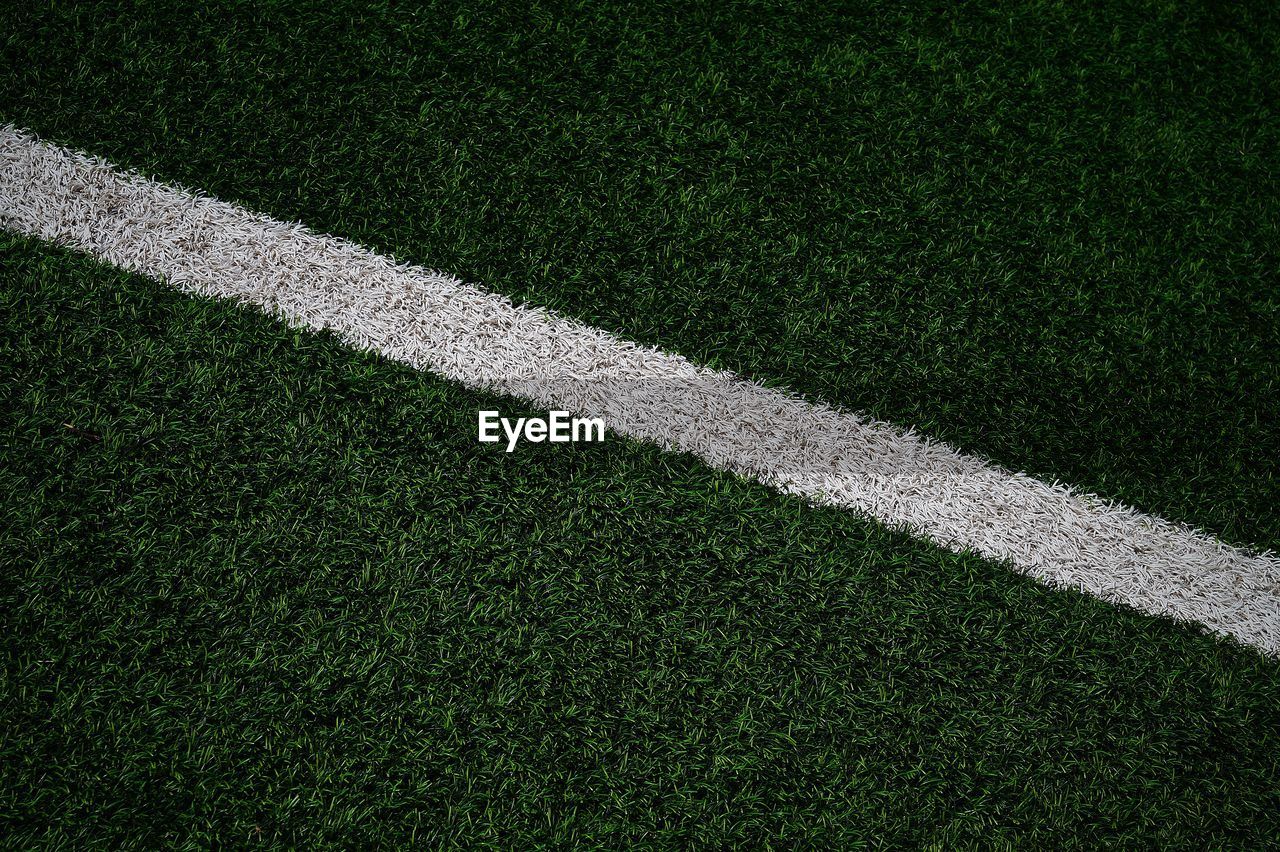 HIGH ANGLE VIEW OF SOCCER FIELD AGAINST SKY