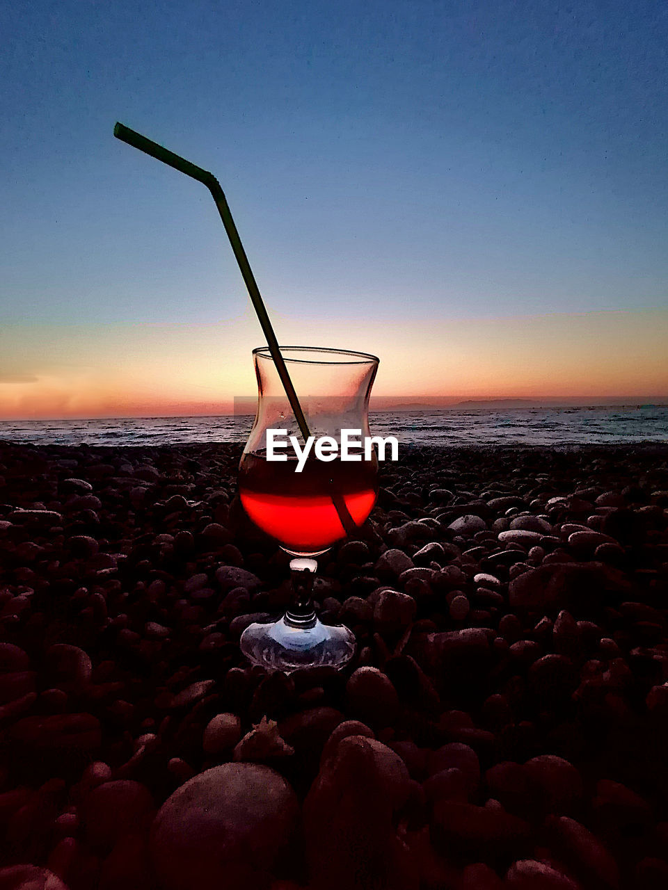 VIEW OF DRINK ON BEACH