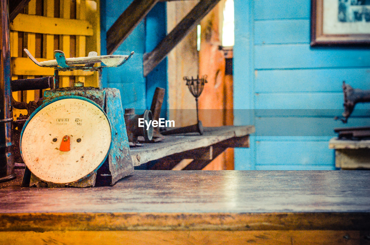 Old-fashioned weight scale on wooden table