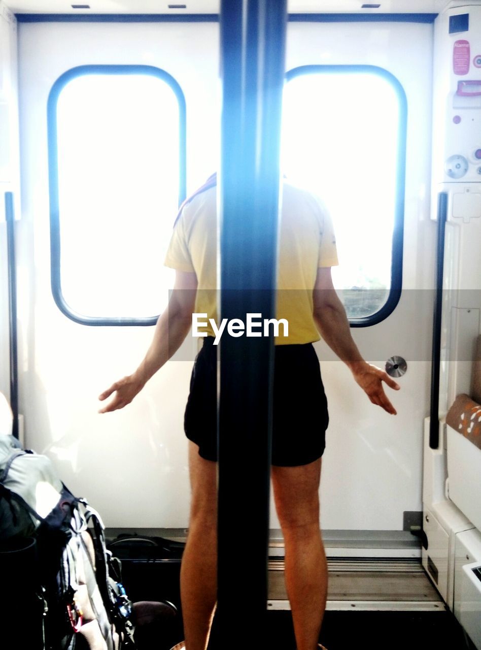 Rear view of man in the train