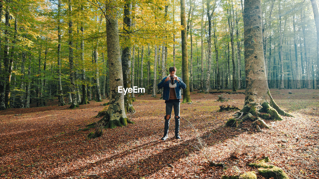 Boy walks with vr viewer in the mountains in autumn