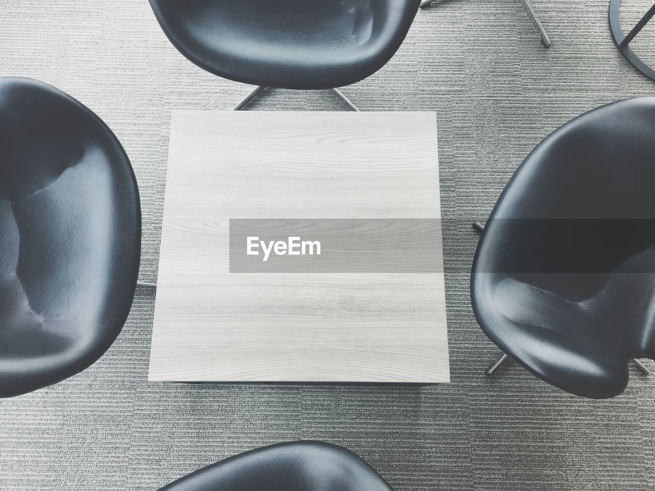 High angle view of empty chairs and table