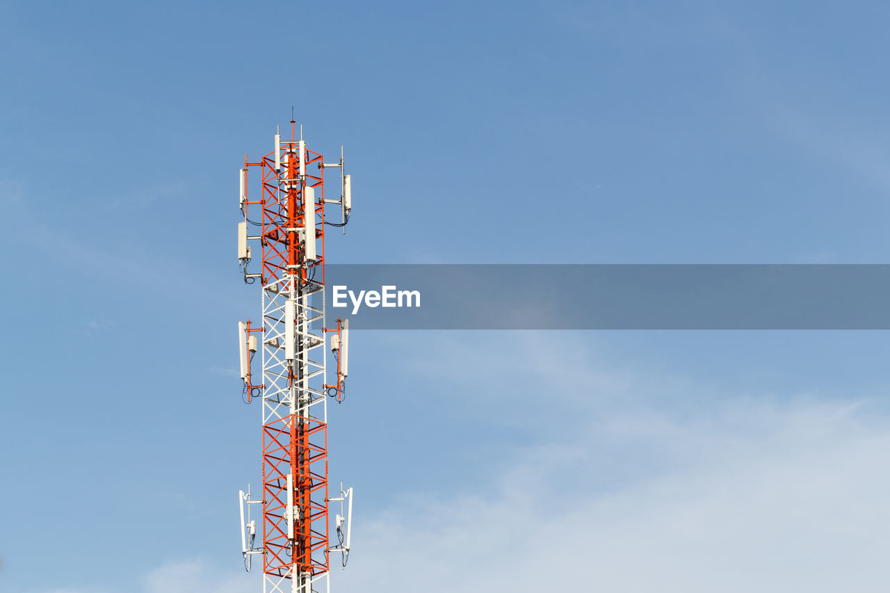 Low angle view of communications tower against sky
