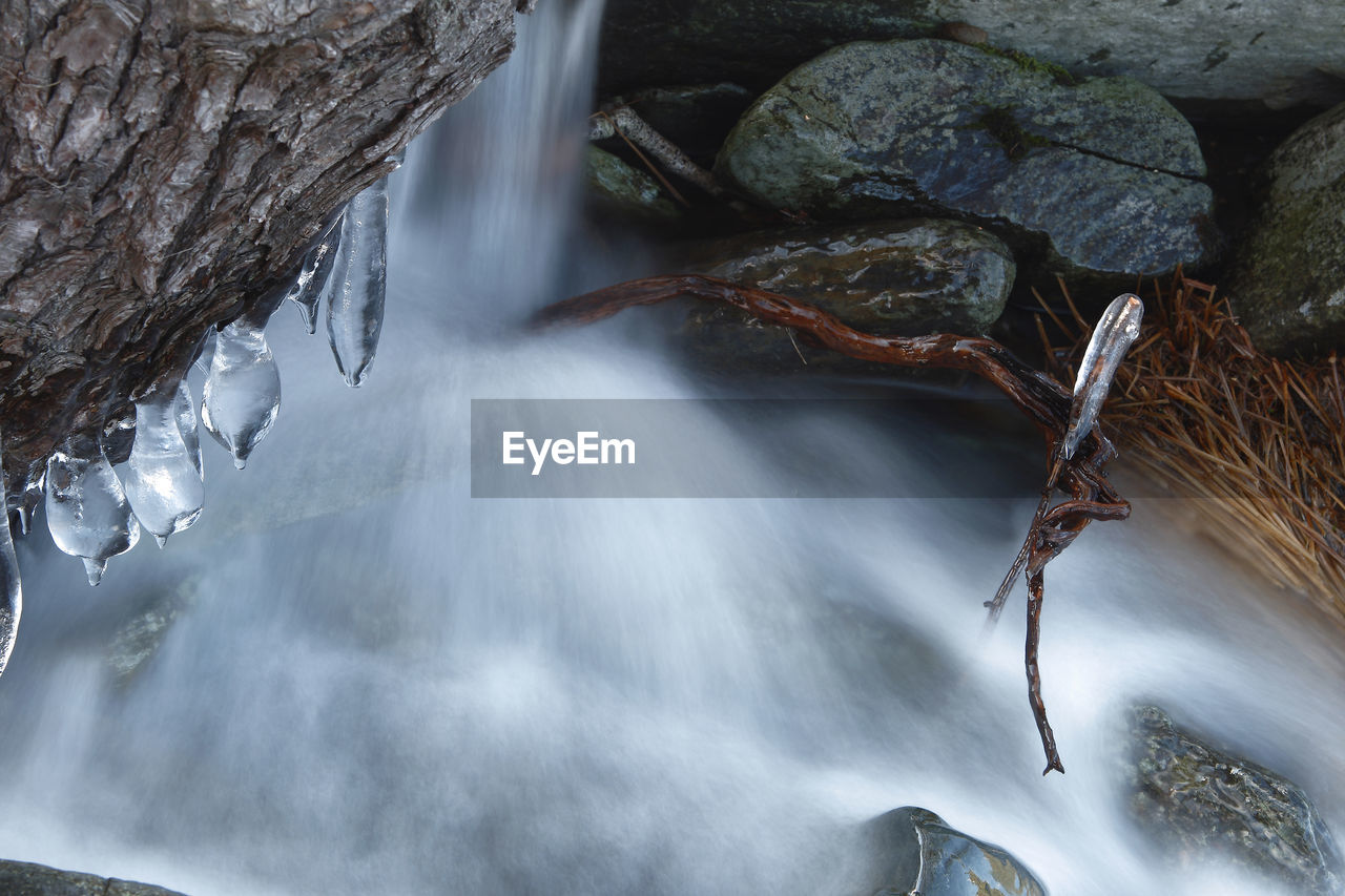 WATER FLOWING FROM ROCK