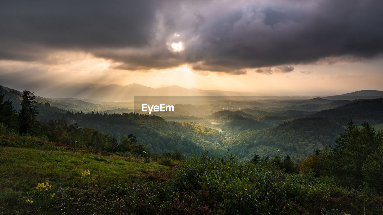 The sun shines through the cloud cover into the murgtal in the northern black forest