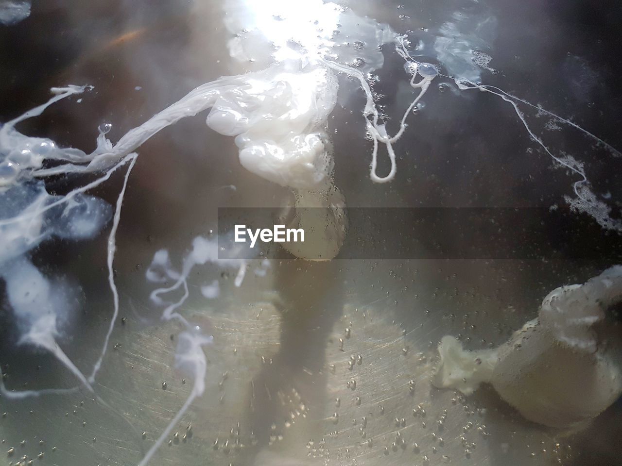 CLOSE-UP OF WATER SPLASHING ON LAKE