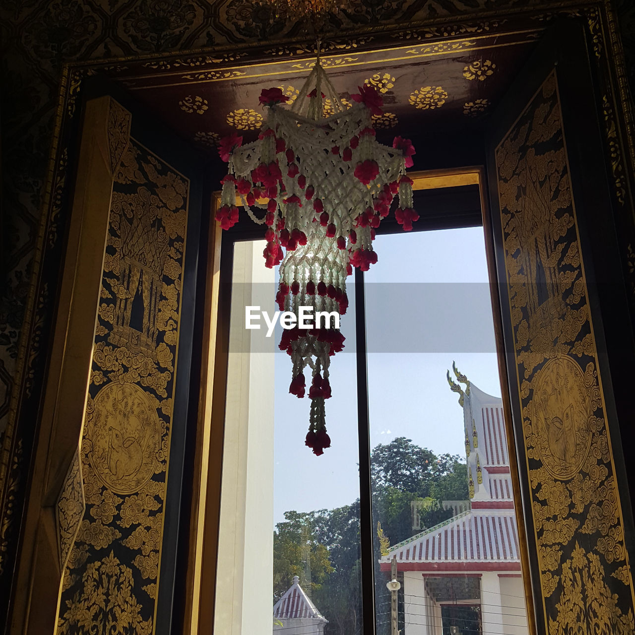LOW ANGLE VIEW OF LANTERNS HANGING ON BUILDING