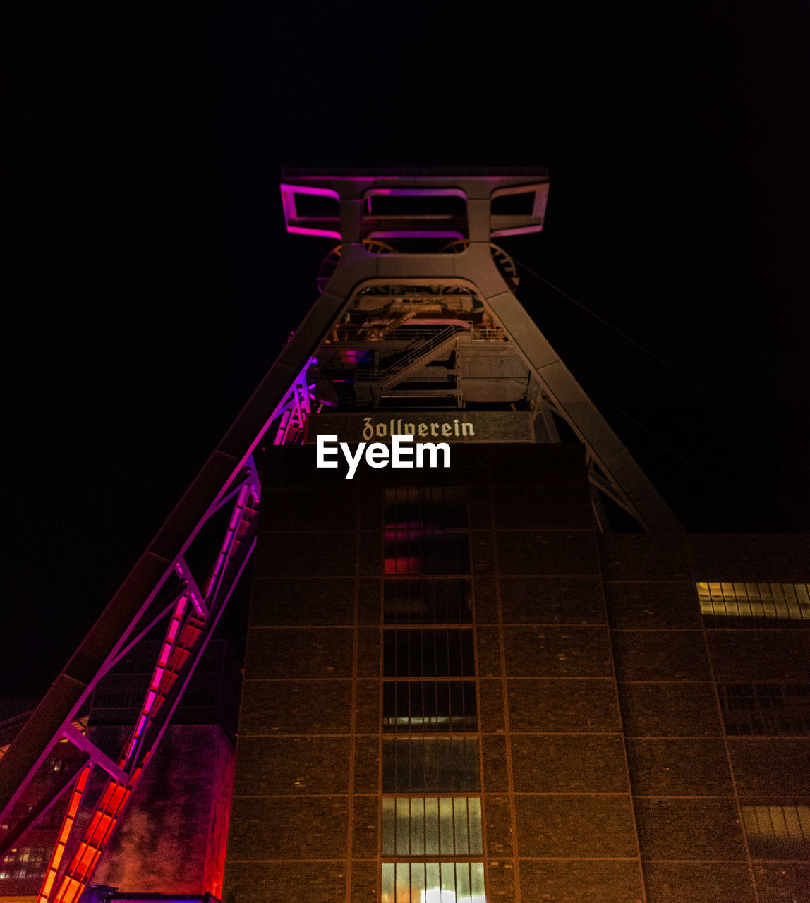 LOW ANGLE VIEW OF ILLUMINATED BUILDING