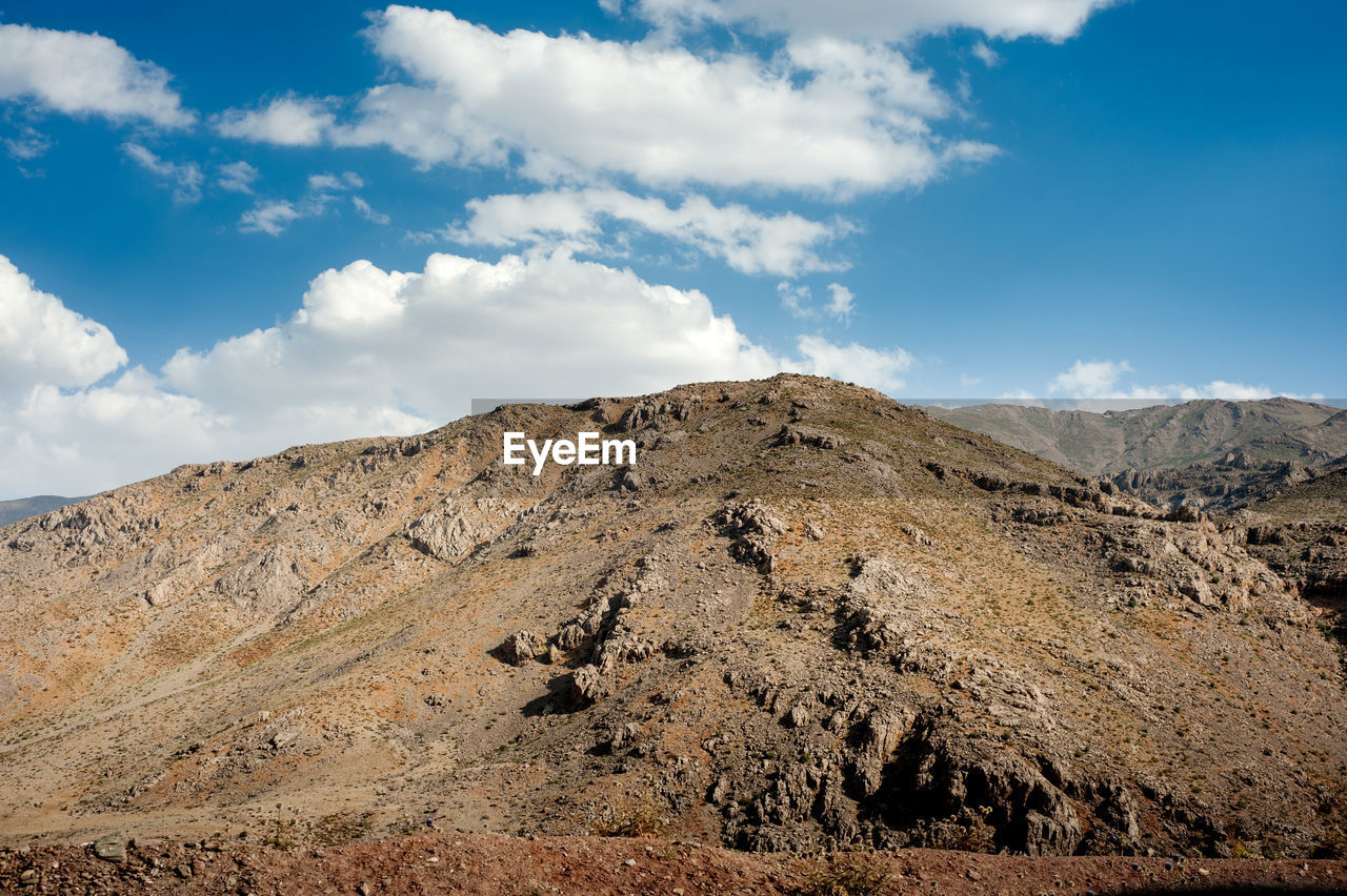 Rocky mountains with autumnal foliage and cloudy sky, rocky mountain khuzestan province, iran