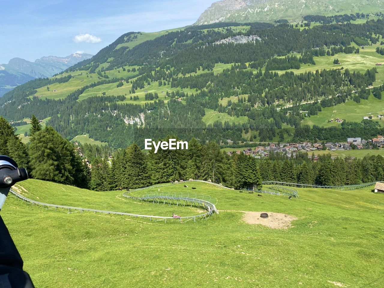 Scenic view of grassy field against mountains