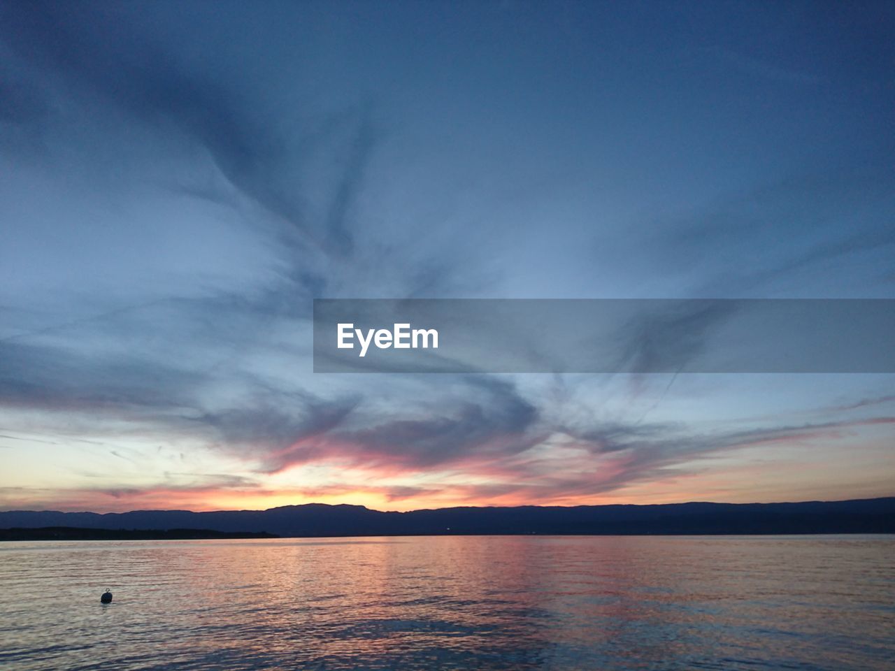 SCENIC VIEW OF SEA AGAINST ORANGE SKY