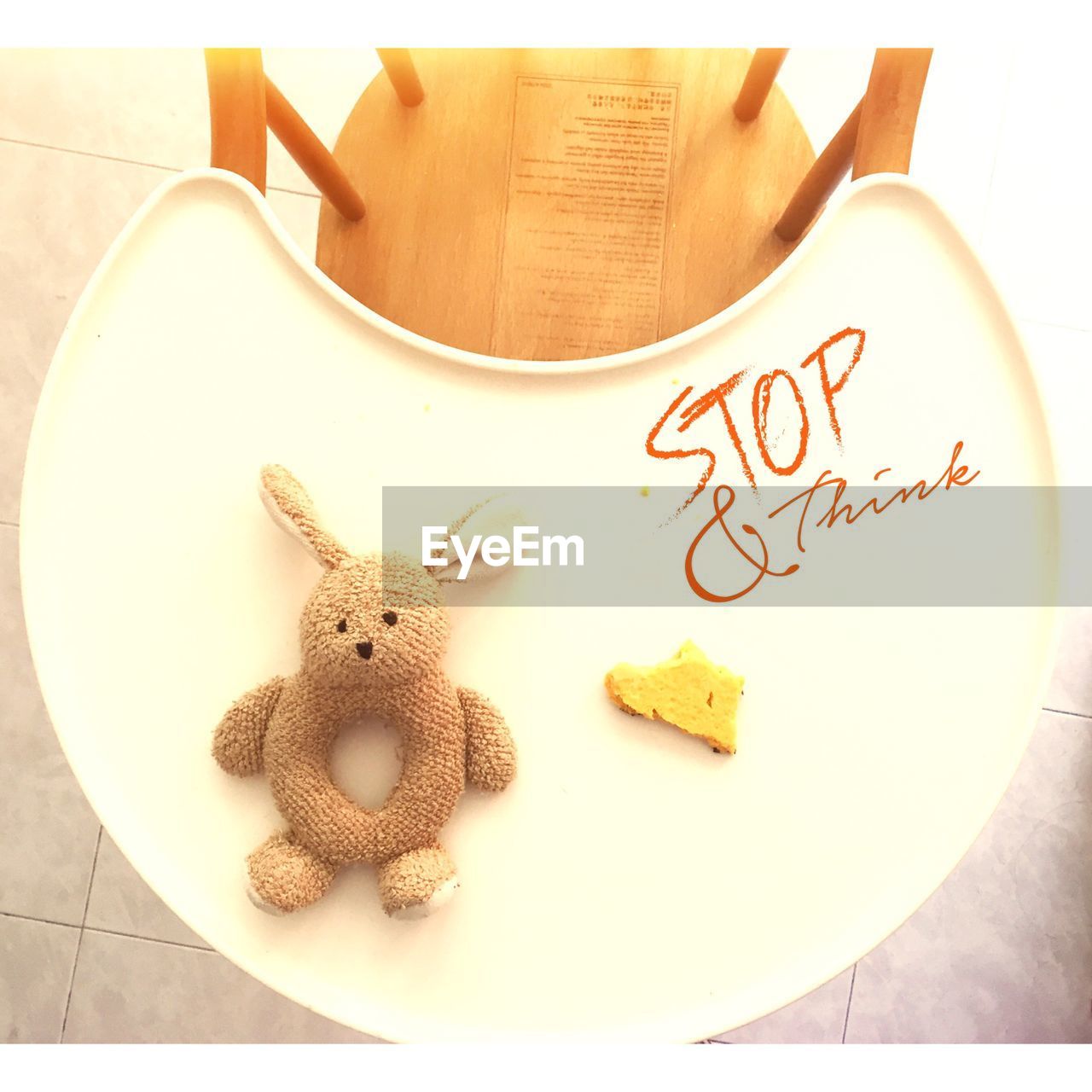 High angle view of stuffed toy on table with text