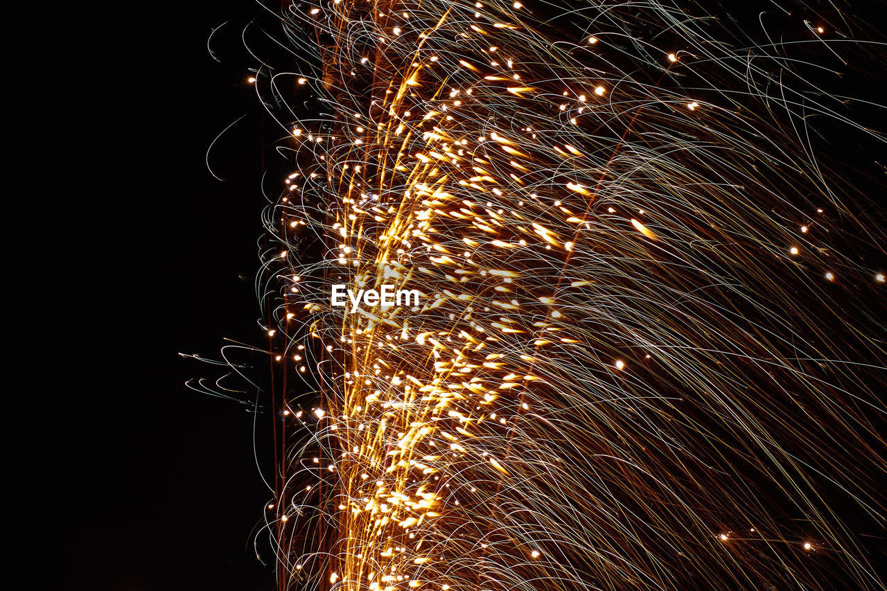 LOW ANGLE VIEW OF FIREWORK DISPLAY AGAINST SKY