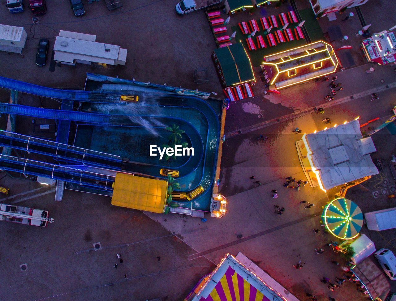 HIGH ANGLE VIEW OF ILLUMINATED CITY STREET