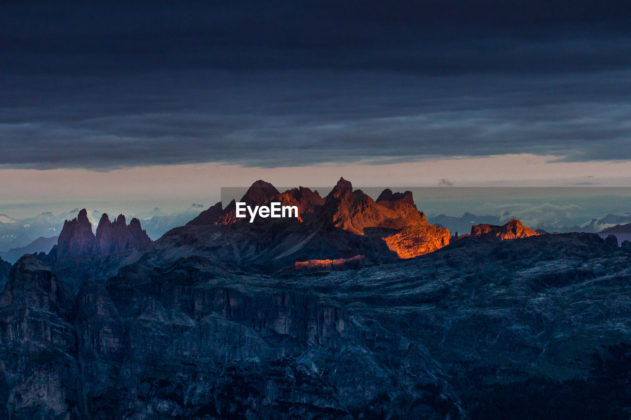 ROCK FORMATIONS AGAINST SKY DURING SUNSET