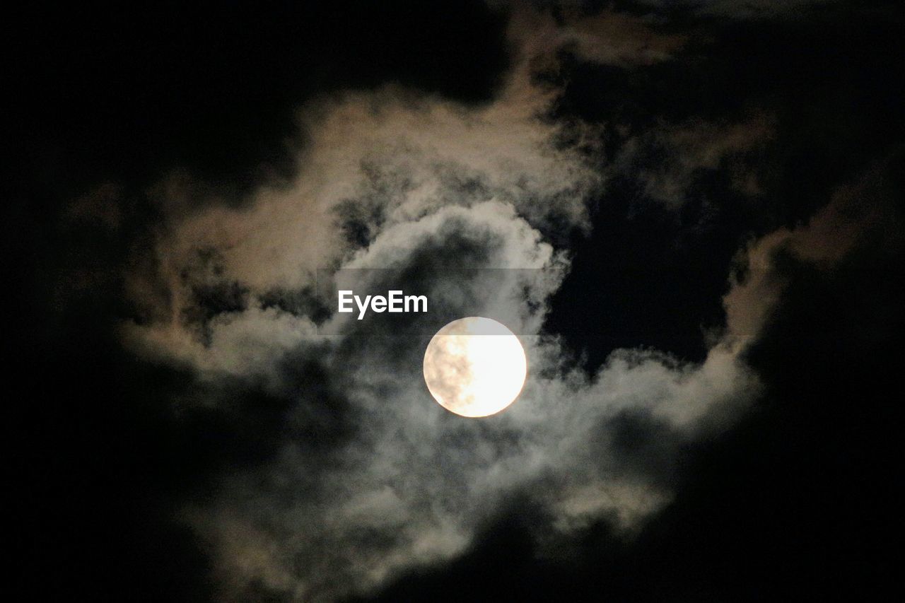 LOW ANGLE VIEW OF MOON IN SKY